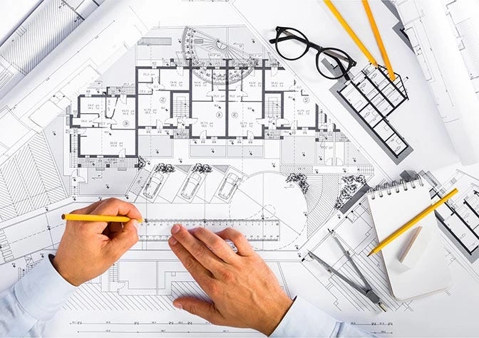 Blueprints and SEO strategy on tablet showing construction data