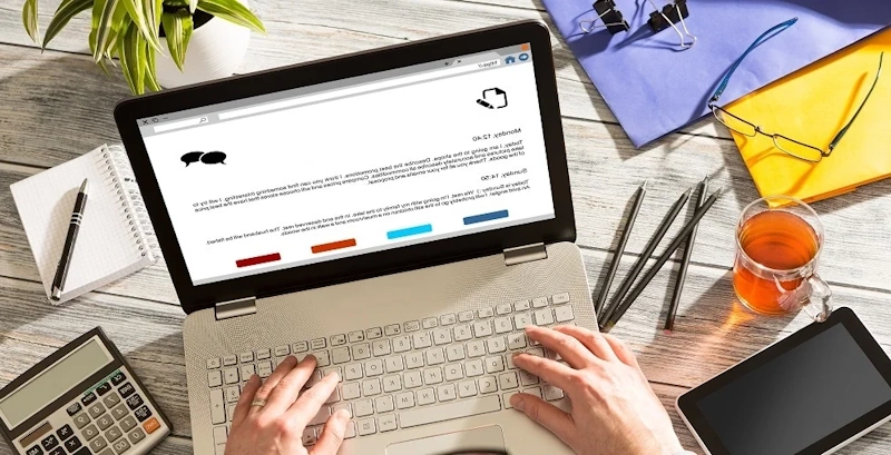 Writer crafting SEO blog post with branded images on computer